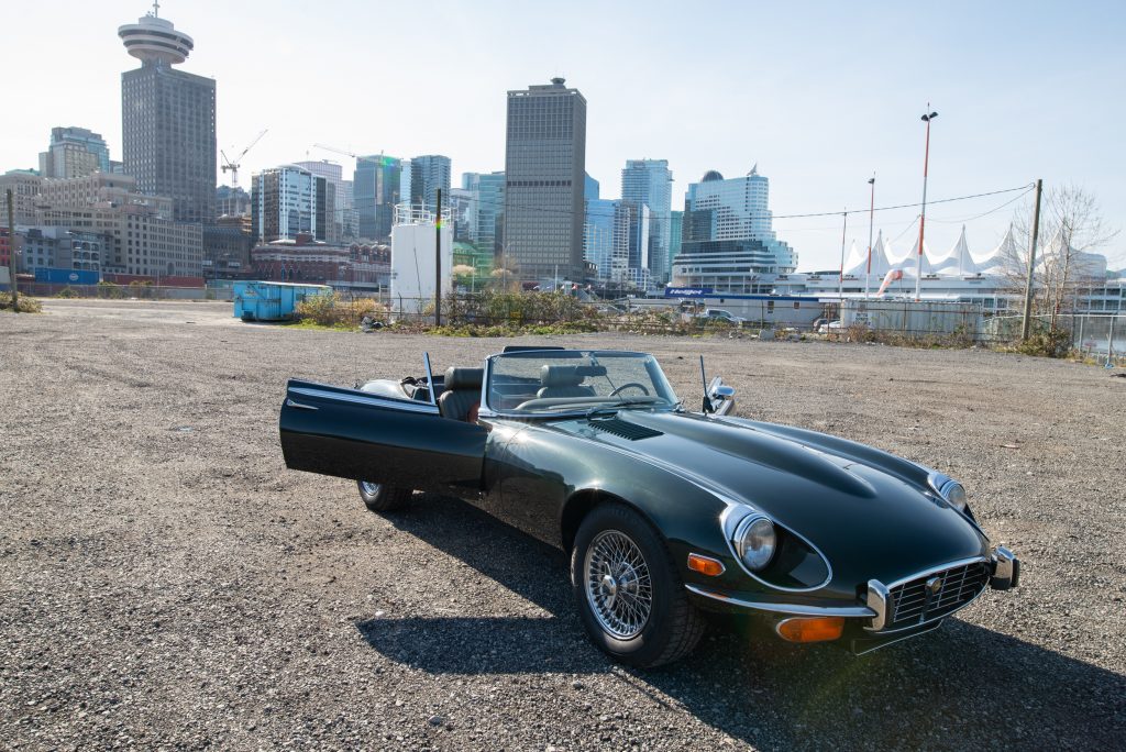 1974 Jaguar E-Type opalescent green front passenger side doors open