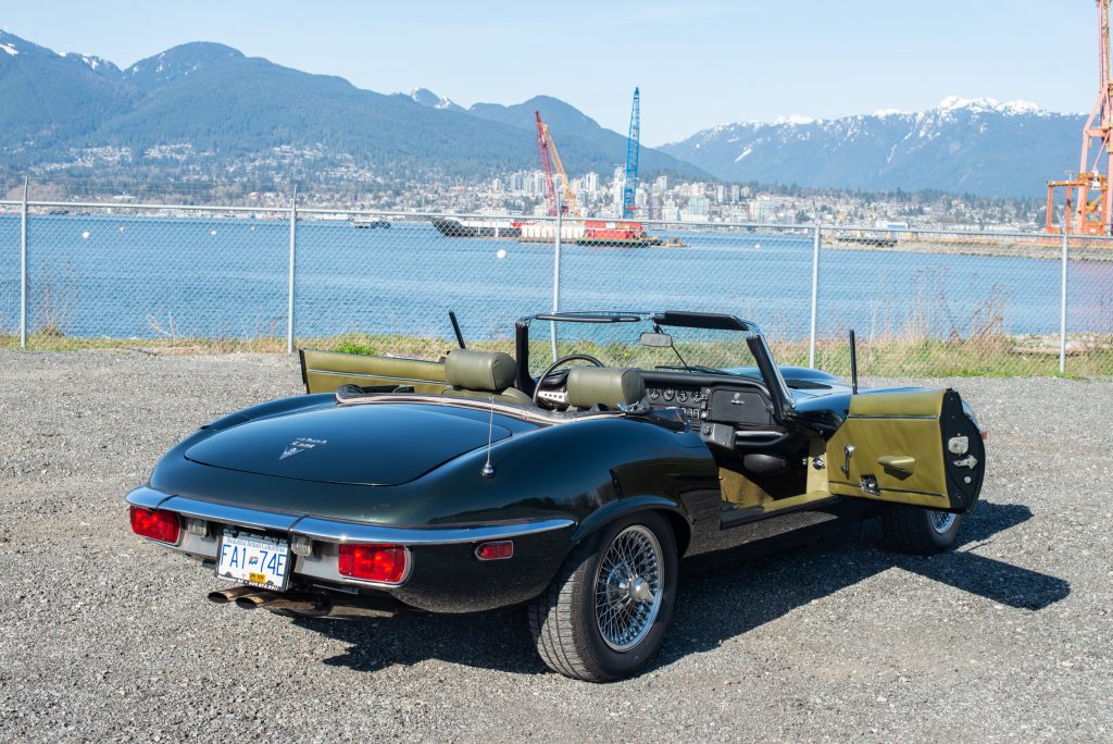 1974 Jaguar E-Type opalescent green rear passsenger door open